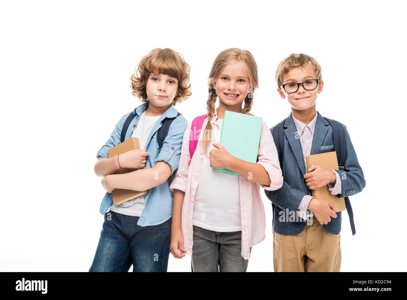 schoolchildren with backpacks and books Stock Photo