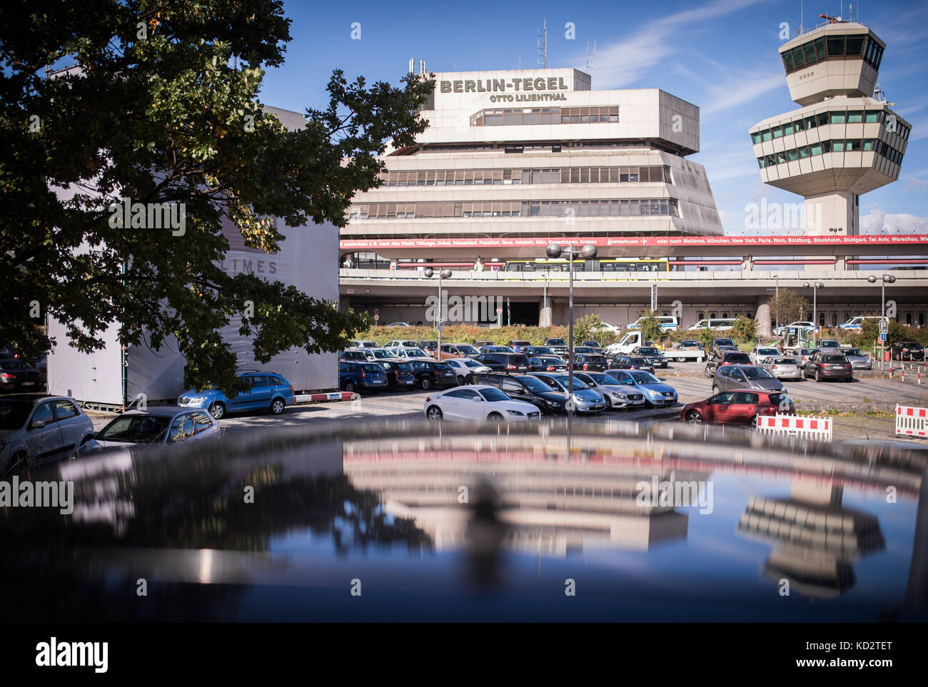 The BerlinTegel Airport mirrored by a car's windshield in Berlin