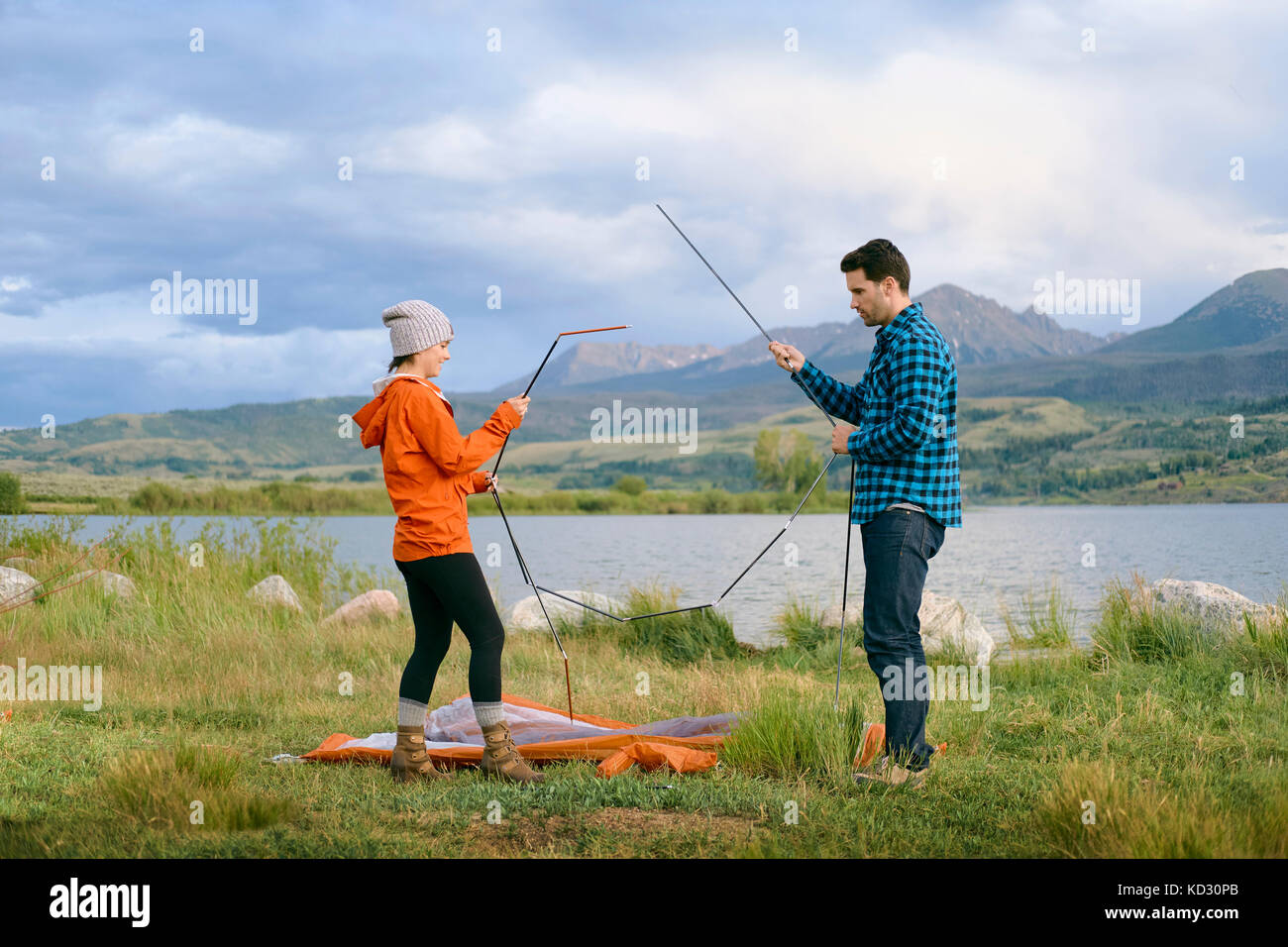 Couple in rural setting, putting up tent, Heeney, Colorado, United States Stock Photo