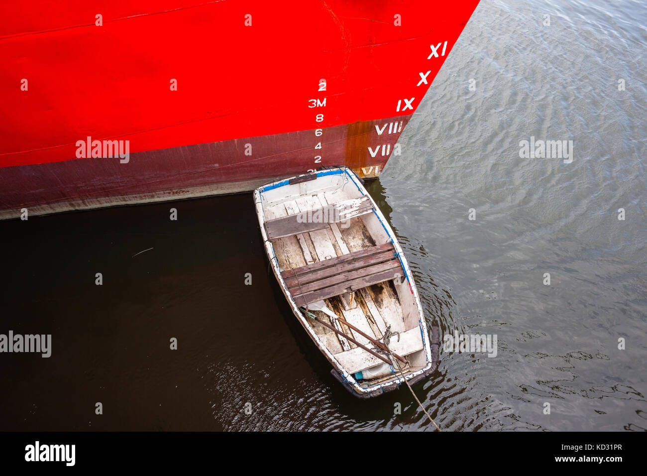 Ship boat bow with depth cargo numbers in red paint closeup in hatbor