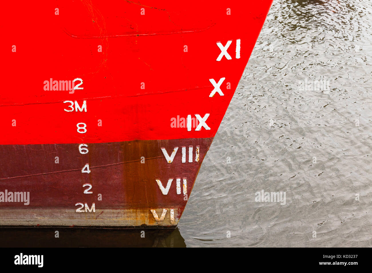 Ship boat bow with depth cargo numbers in red paint closeup in hatbor