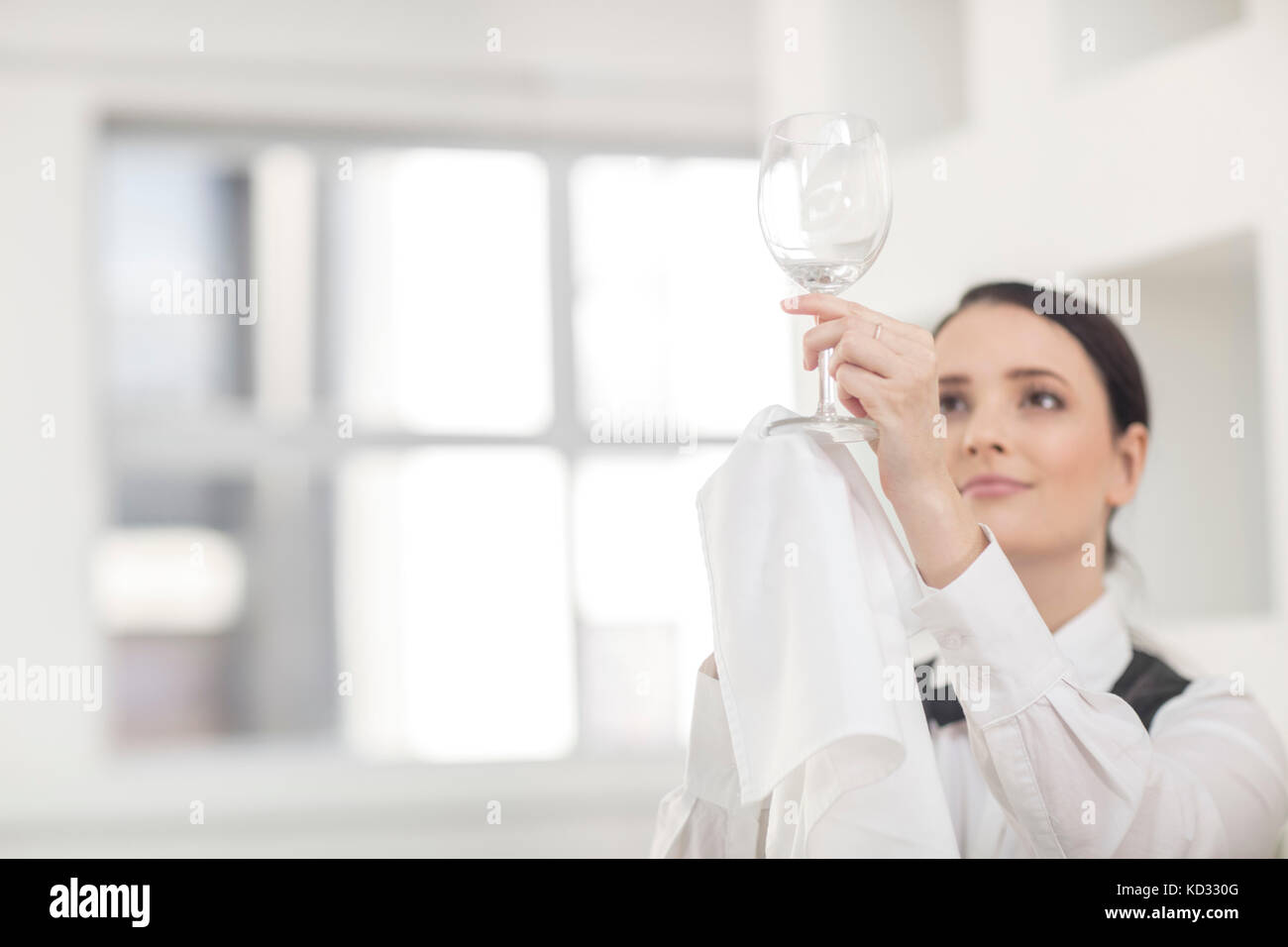 Waitress polishing wine glass in restaurant Stock Photo 162952064 Alamy