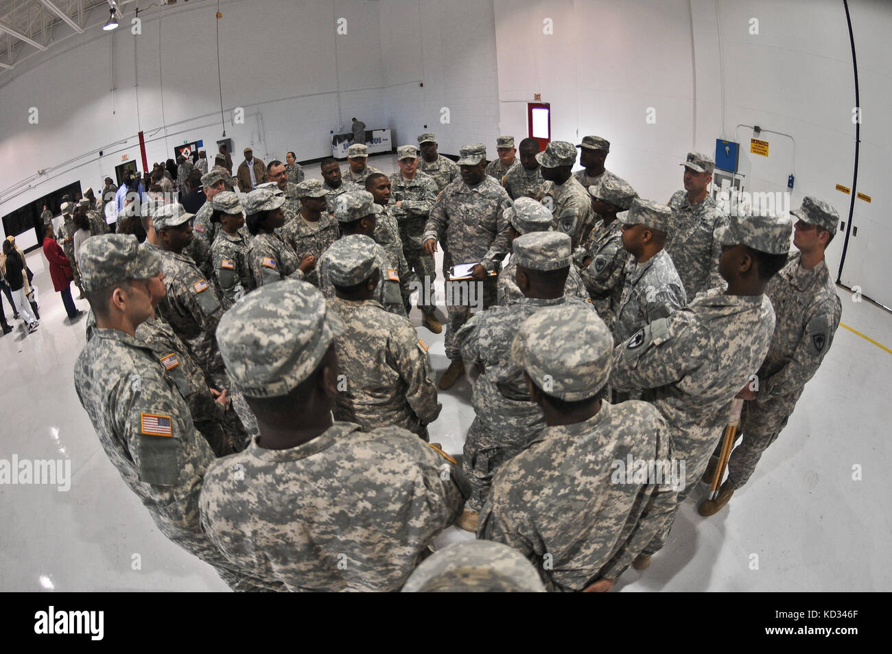 Family and friends of U.S. Soldiers assigned to the 351st Aviation Support Battalion, S.C. Army National Guard, attend a casing of the colors and deployment ceremony held Feb. 15, 2015, at the Army Aviation flight facility at McEntire Joint National Guard base, Eastover, South Carolina. The 351st ASB will deploy to Kuwait for approximately one year to support the 185th Theater Aviation Brigade, for Operation Spartan Shield. (U.S. Army National Guard photo by Staff Sgt. Roberto Di Giovine/Released) Stock Photo