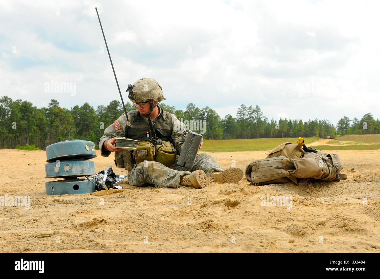 U.S. Army Staff Sgt. Andrew Brazell, assigned to 1221st Route Clearance Company, South Carolina Army National Guard, prepares C-4 explosives to detonate improvised explosive devices during a route clearance training scenario at McCrady Training Center, Eastover, S.C., June 24, 2014.  Brazell’s mission is to locate command wires to IED’s and provide security in case of an attack. (U.S. Air National Guard photo by Tech. Sgt. Jorge Intriago/Released) Stock Photo