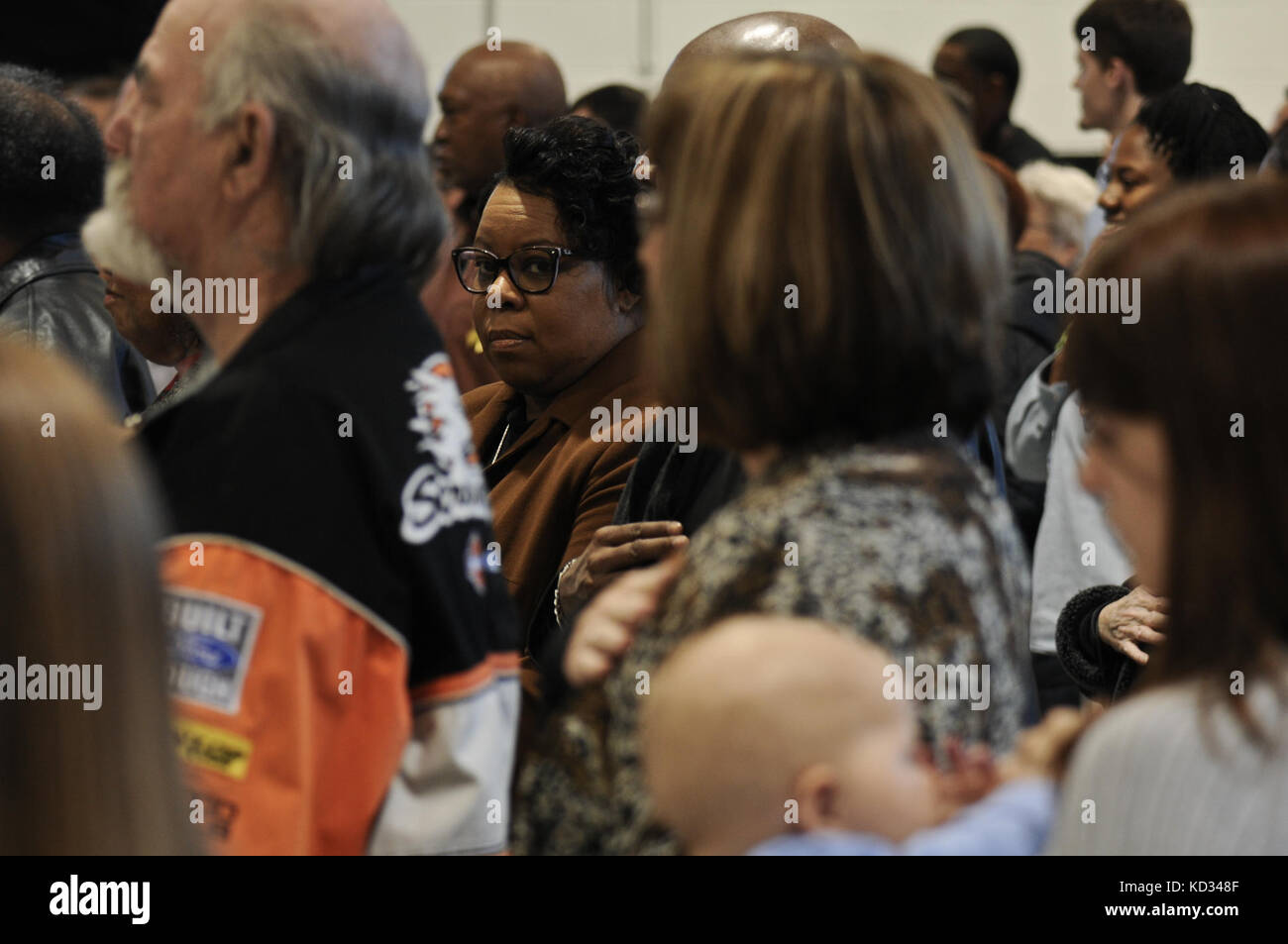 Family and friends observe the formation of U.S. Soldiers assigned to the 351st Aviation Support Battalion, S.C. Army National Guard, during a casing of the colors and deployment ceremony held Feb. 15, 2015, at the Army Aviation flight facility at McEntire Joint National Guard base, Eastover, South Carolina. The 351st ASB will deploy to Kuwait for approximately one year to support the 185th Theater Aviation Brigade, for Operation Spartan Shield. (U.S. Army National Guard photo by Staff Sgt. Roberto Di Giovine/Released) Stock Photo