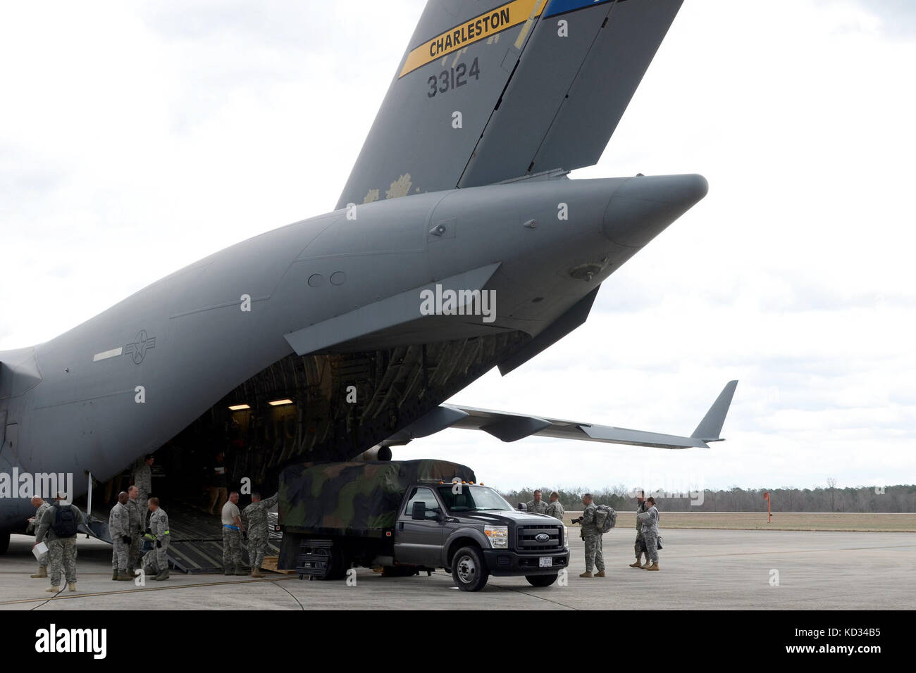 U.S. Airmen of the 169th Logistics Readiness Squadron of the South Carolina Air National Guard and members of the 14th Airlift Squadron at Joint Base Charleston, S.C., prepare to unload support equipment for the Vigilant Guard exercise March 5, 2015, at McEntire Joint National Guard Base S.C. Vigilant Guard is series of federally funded disaster-response drills conducted by National Guard units working with federal, state and local emergency management agencies and first responders. (U.S. Air National Guard photo by Airman 1st Class Ashleigh S. Pavelek/Released) Stock Photo