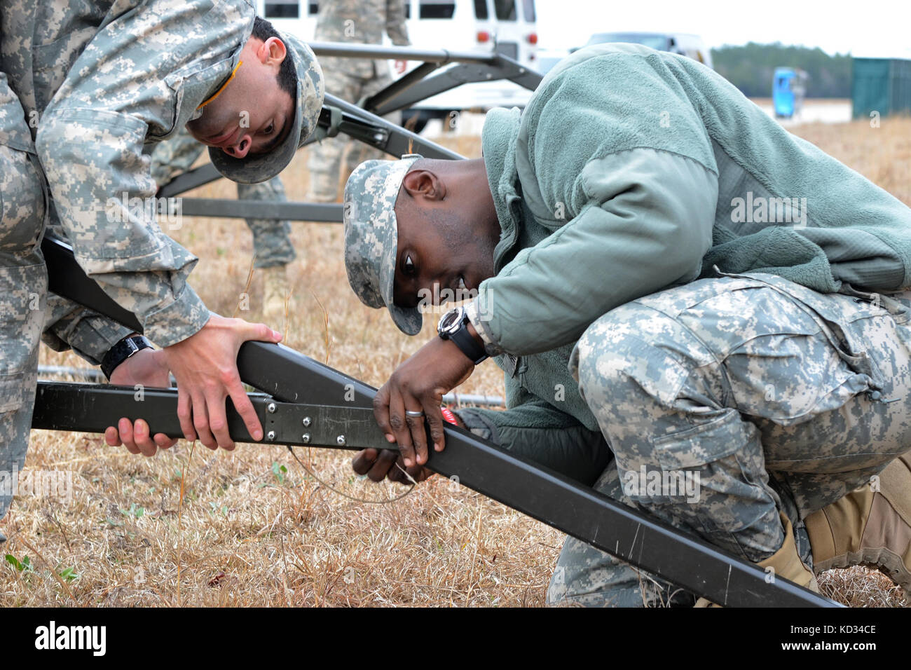 U.S. Army Pvt. Demetrius Fuel, an intel analyst, and Pvt. Peter Brost, an information technology specialist, both assigned to the Headquarters and Headquarters Company  2151, South Carolina Army National Guard, assemble a tent during the Vigilant Guard exercise March 6, 2015, at Georgetown Airport, S.C.  Vigilant Guard is a series of federally funded disaster-response drills conducted by National Guard units working wth federal, state and local emergency management agencies and first responders.  (Air National Guard photo by Airman 1st Class Ashleigh S. Pavelek/Released) Stock Photo