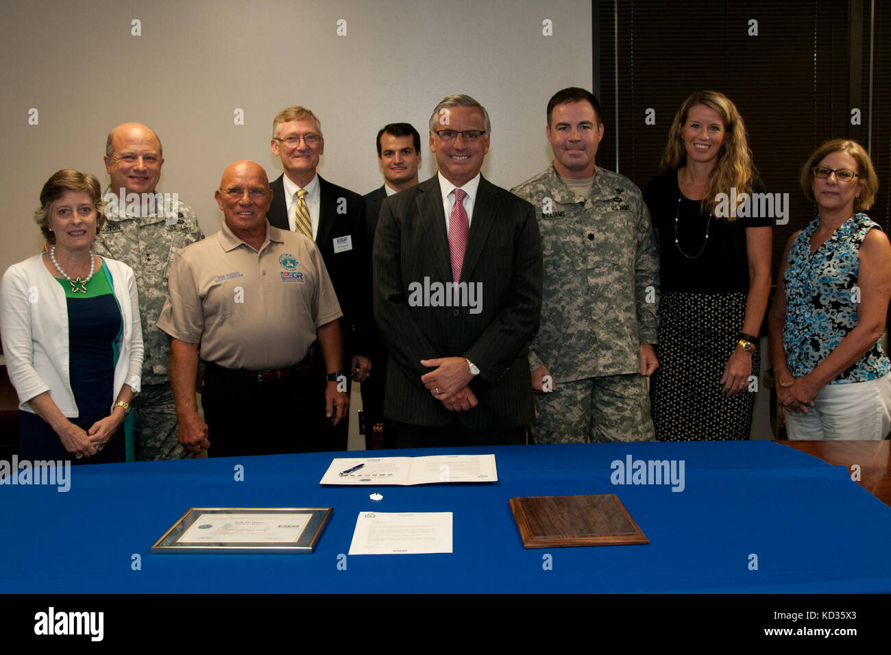 U.S. Army Maj. Gen. Robert E. Livingston, Jr., the adjutant general for South Carolina, presents the South Carolina Employer Support of Guard and Reserve Patriot Award to Mr. Will McMaster of Morgan Stanley at the Joint Force Headquarters building, South Carolina National Guard, Columbia, South Carolina, Aug. 27, 2015. The Patriot award is awarded to individual supervisors who demonstrate exceptional support to National Guard Citizen Soldiers and Airmen who perform their duties to the state and nation. During the event, an ESGR statement of support was signed demonstrating the company’s contin Stock Photo