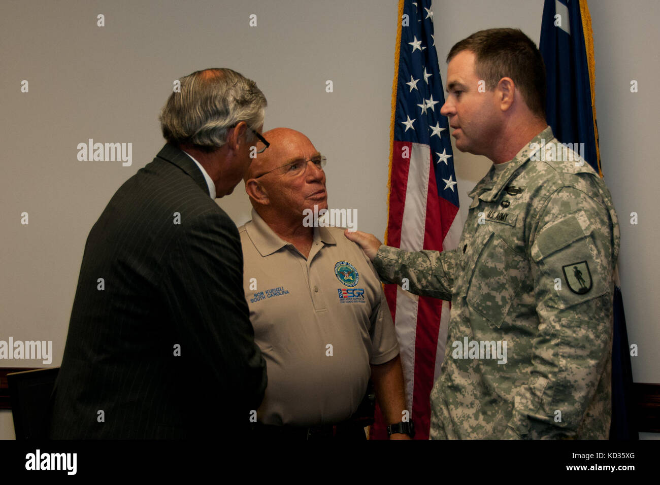 U.S. Army Maj. Gen. Robert E. Livingston, Jr., the adjutant general for South Carolina, presents the South Carolina Employer Support of Guard and Reserve Patriot Award to Mr. Will McMaster of Morgan Stanley at the Joint Force Headquarters building, South Carolina National Guard, Columbia, South Carolina, Aug. 27, 2015. The Patriot award is awarded to individual supervisors who demonstrate exceptional support to National Guard Citizen Soldiers and Airmen who perform their duties to the state and nation. During the event, an ESGR statement of support was signed demonstrating the company’s contin Stock Photo