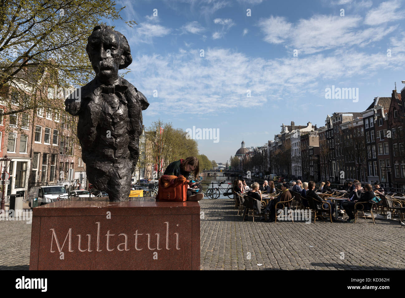 A statue of the writer Multatuli, Eduard Douwes Dekker, on a bridge over the Singel canal in Amsterdam Stock Photo