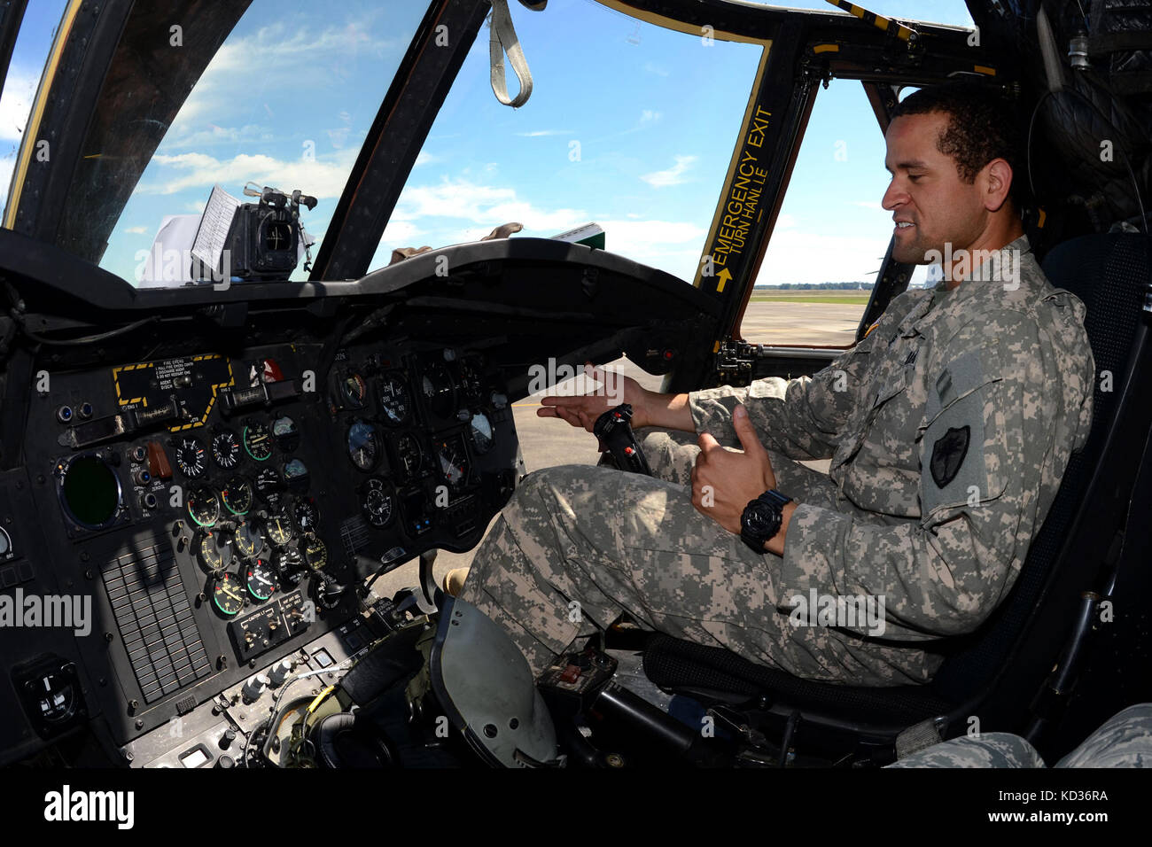 U.S. Army 1st Lt. T.J. Rose, a pilot with the South Carolina Army National Guard's 2-238th General Support Aviation Battalion Detachment 1, performs pre-flight checks on a Boeing CH-47 Chinook helicopter at McEntire Joint National Guard Base, S.C., during a statewide flood response, Oct. 6, 2015. The South Carolina National Guard has been activated to support state and county emergency management agencies and local first responders as historic flooding impacts counties statewide. Currently, more than 2,200 South Carolina National Guard members have been activated in response to the floods. (U. Stock Photo