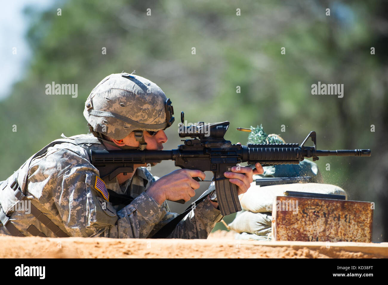 U.S. Army Sgt. Christopher Lee an automated logistic specialist assigned to the HHC, 4-118th Combined Arms Battalion, 218th Maneuver Enhancement Brigade, South Carolina Army National Guard, fires his M4 carbine at the qualification range on Fort Jackson, S.C. Feb. 27, 2016. Soldiers are required to qualify on the M4 carbine yearly as part of their training as infantry Soldiers.  (U.S. Air National Guard photo by Tech. Sgt. Jorge Intriago) Stock Photo
