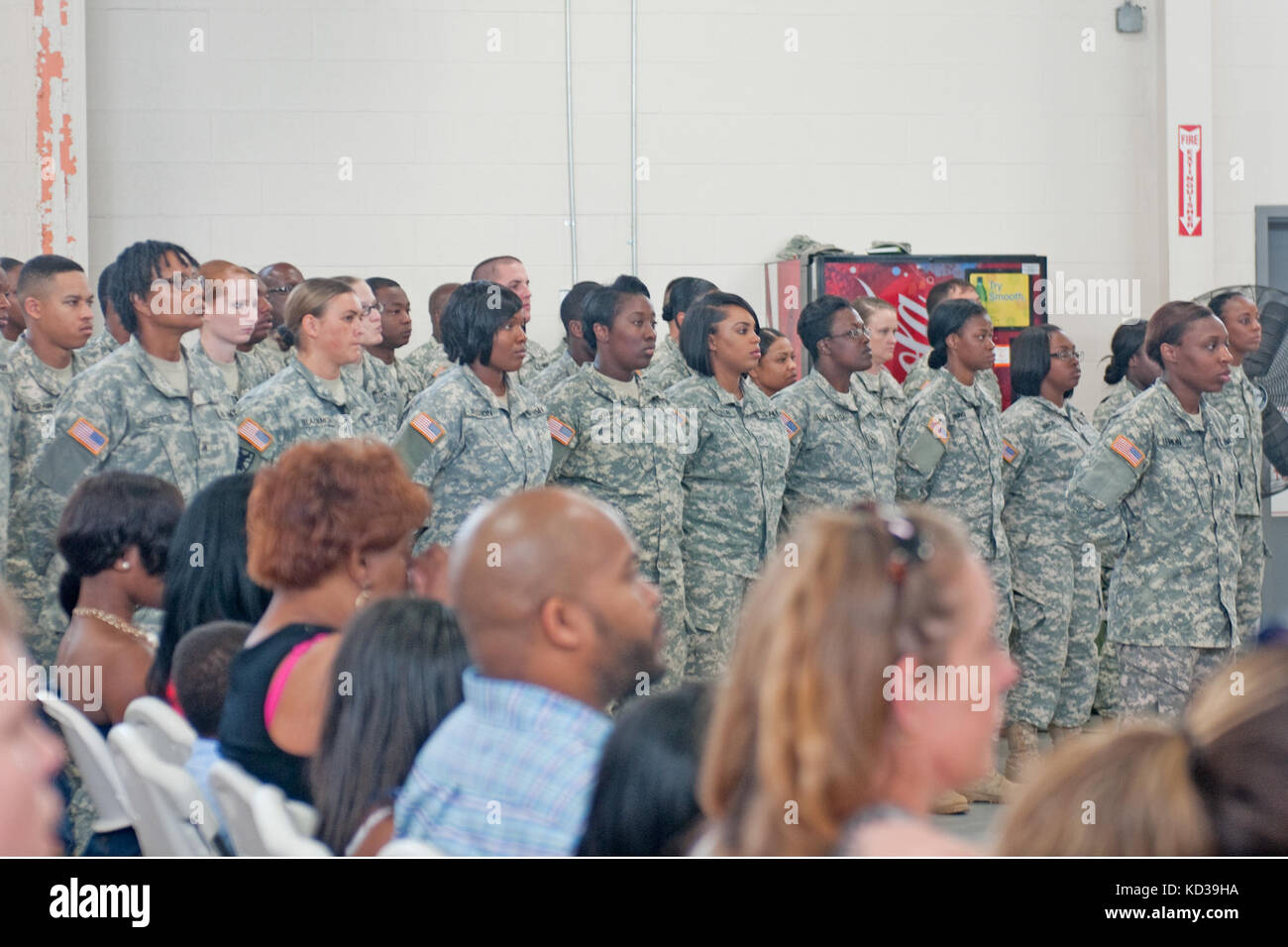 Soldiers and families from the 351st Aviation Support Battalion, South Carolina Army National Guard, attend a departure ceremony at the Sumter Armory in, Sumter, S.C., June 6, 2015. The soldiers will deploy to Texas for training prior to departing to Kuwait for approximately one year. The soldiers will join other members of the unit who deployed earlier this year providing maintenance, fueling and logistics operations support. (U.S. Army National Guard photo by Sgt. Kevin Pickering/Released) Stock Photo