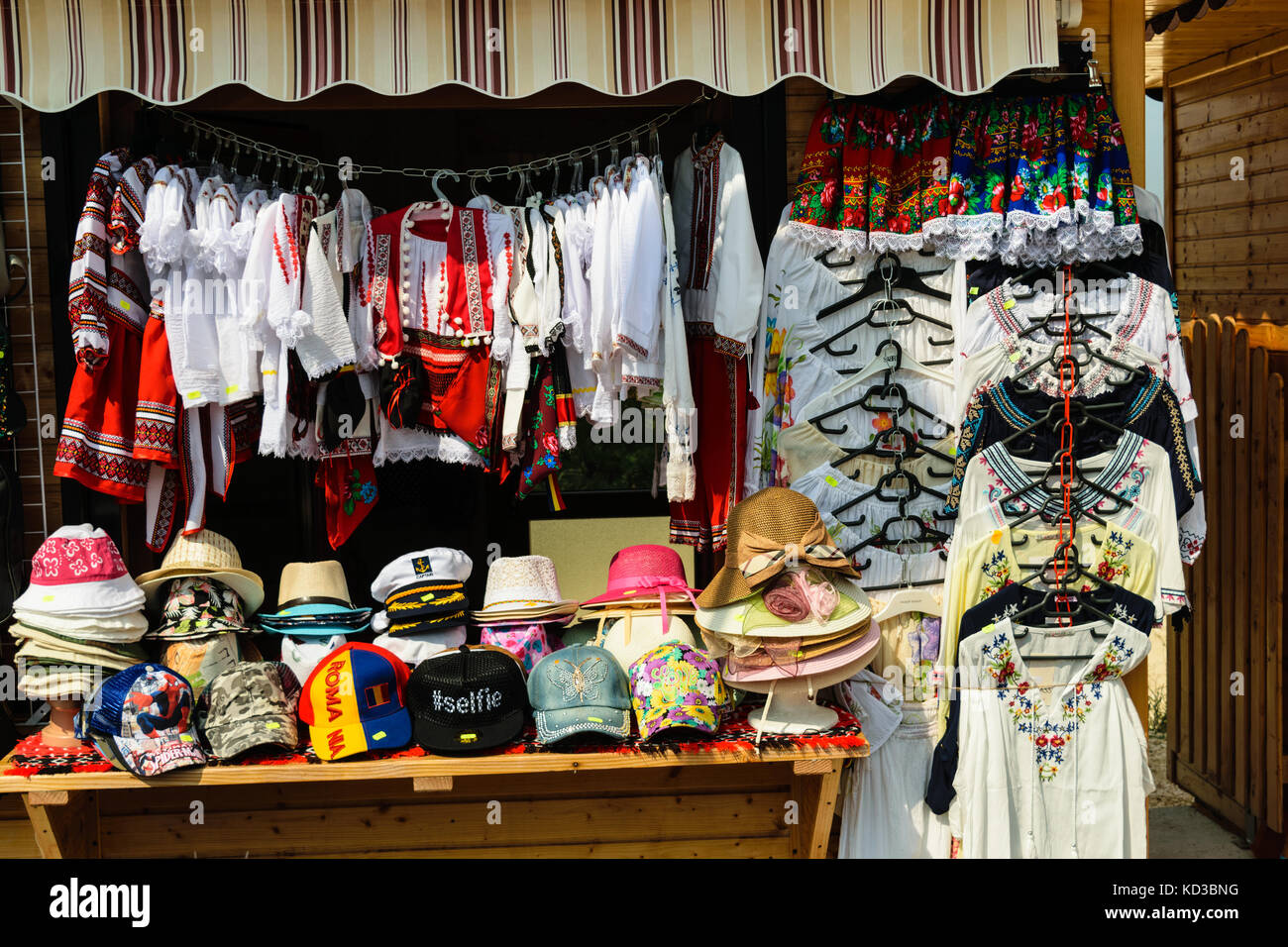 flea market - modern caps and traditional romanian blouses Stock Photo