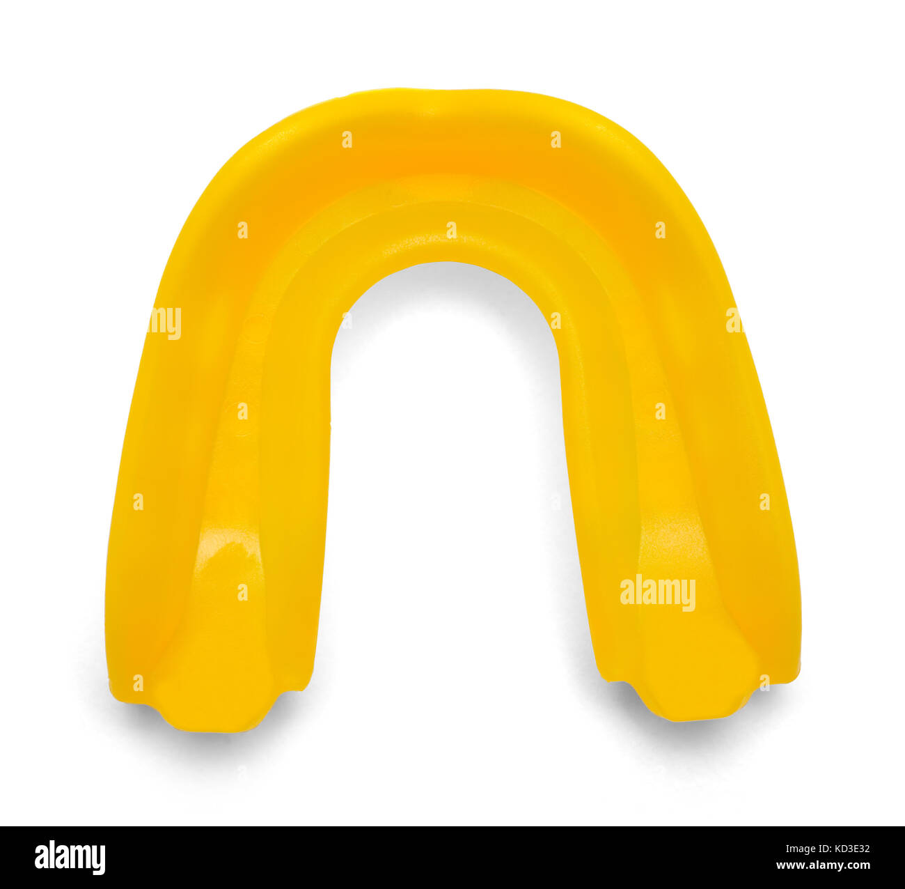 Yellow Rubber Mouthguard Isolated on White Background. Stock Photo