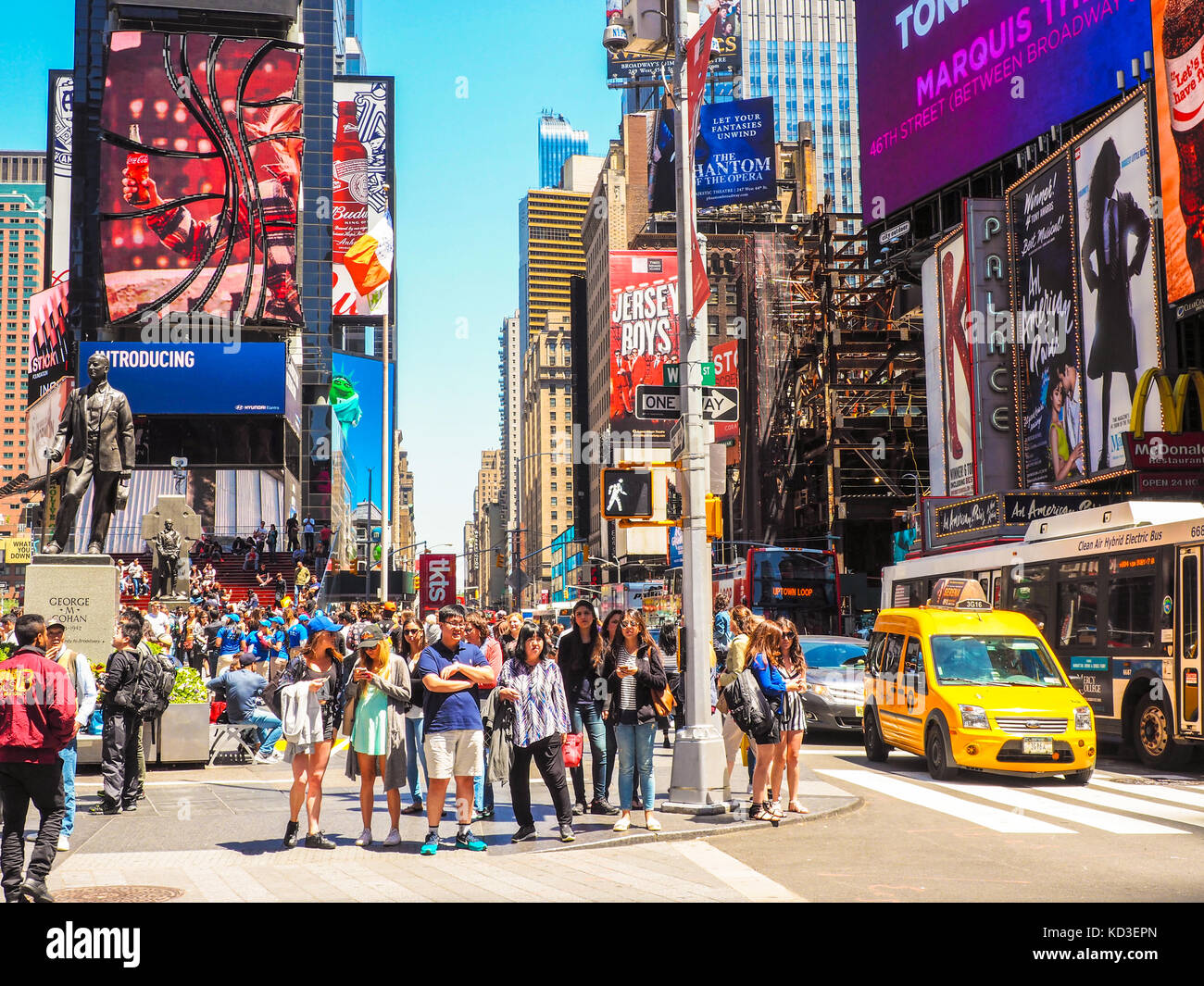 Crowd of people waiting for green light in a Time Square, Manhattan. Stock Photo