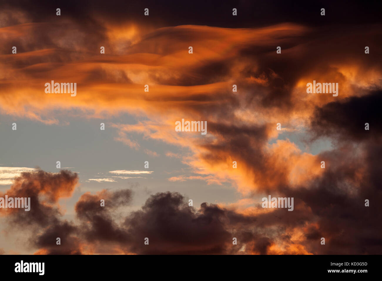Clouds, orange cloudy sky after sunset, evening light, Angra do Heroismo, Terceira Island, Azores, Portugal Stock Photo