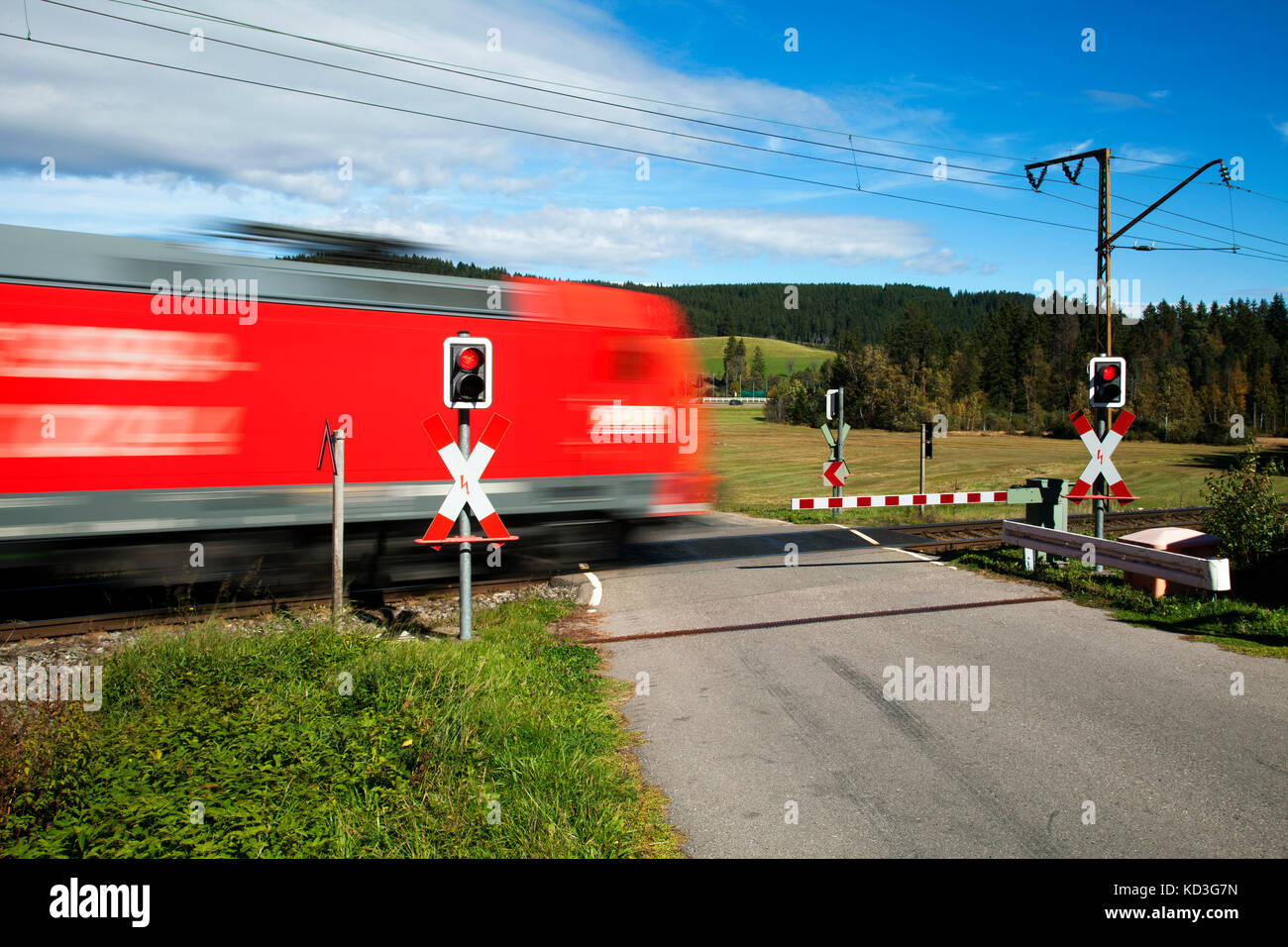 Level crossing with passing train, Andraskreuz, Höllentalbahn, Titisee, Titisee-Neustadt, Black Forest, Baden-Württemberg Stock Photo
