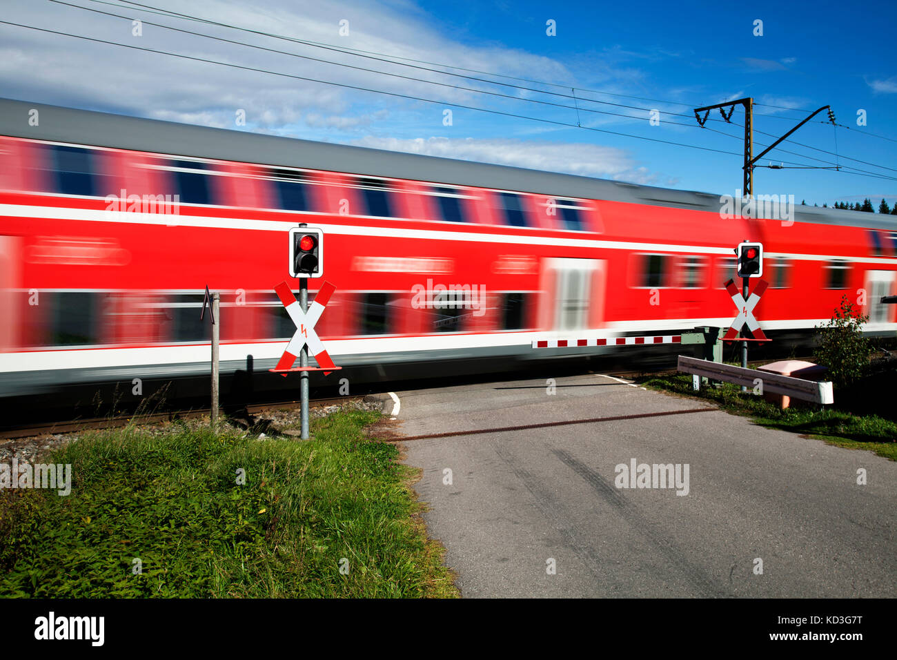 Level crossing with passing train, Andraskreuz, Höllentalbahn, Titisee, Titisee-Neustadt, Black Forest, Baden-Württemberg Stock Photo