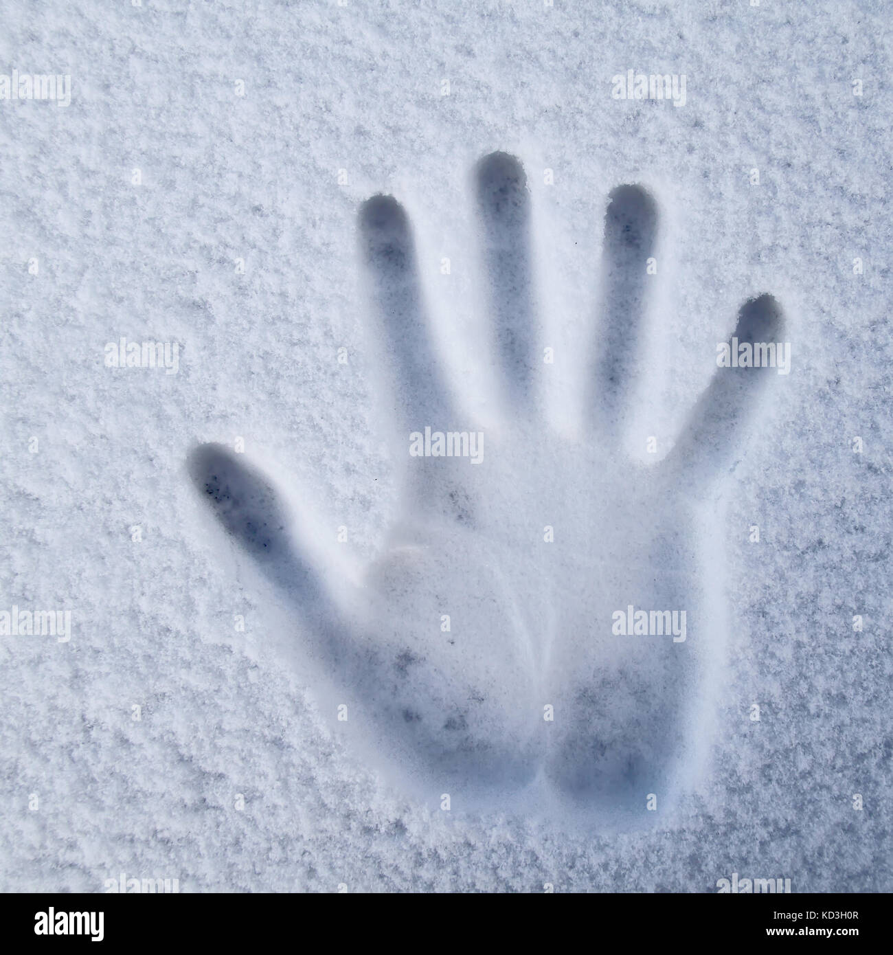 Hand print in snow Stock Photo