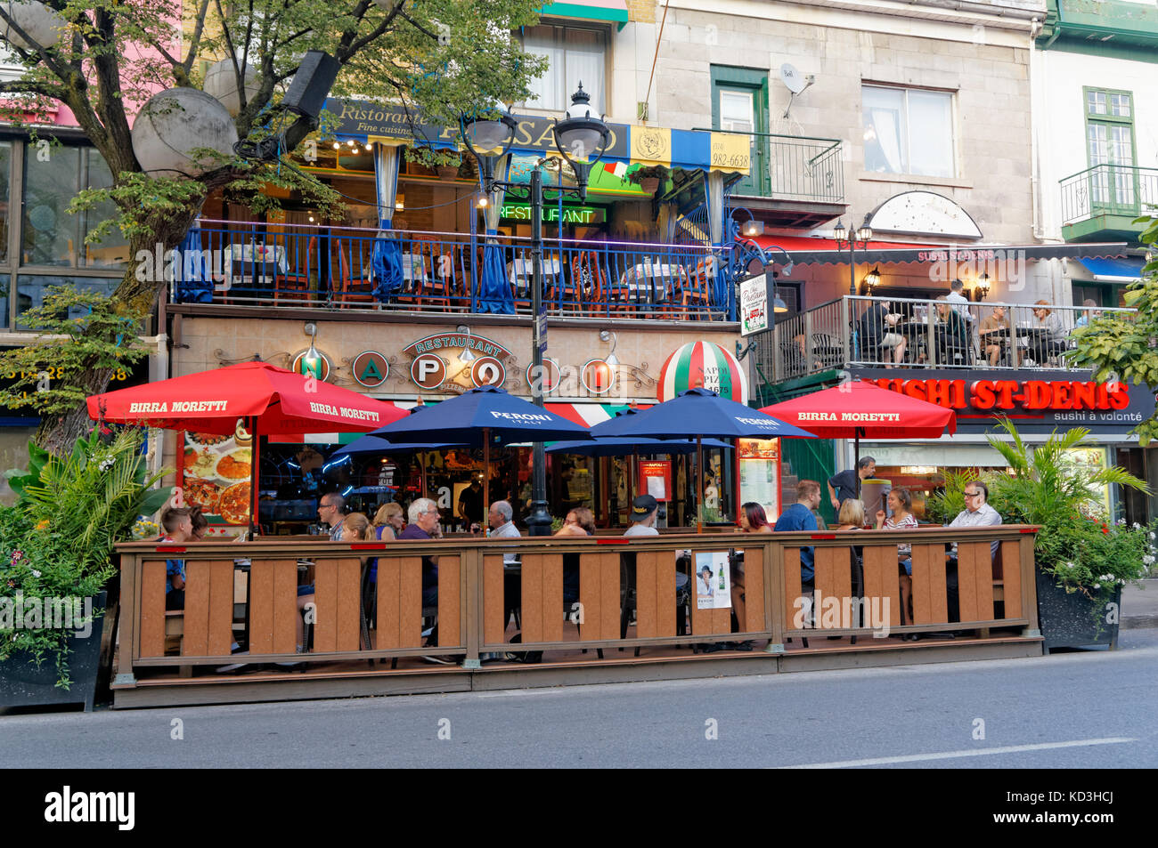 People sitting and talking outdoors at Restaurant Napoli pizzeria on Rue Saint Denis street, Latin Quarter, Quartier Latin, Montreal, Quebec, Canada Stock Photo