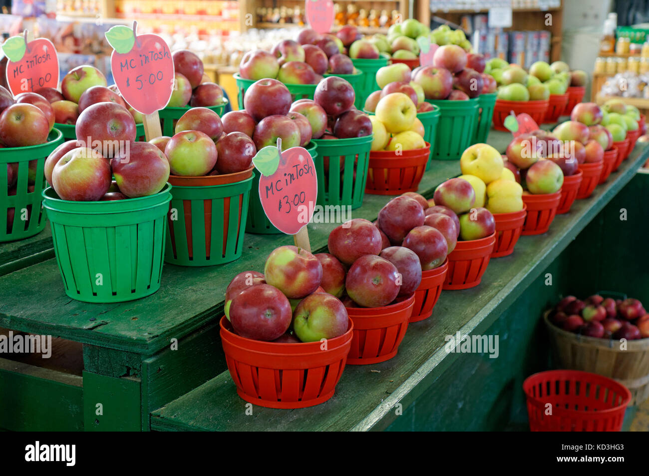 Baskets of fresh Quebec grown McIntosh apples for sale in the Jean Talon public market or Marche Jean Talon, Montreal, Quebec, Canada Stock Photo