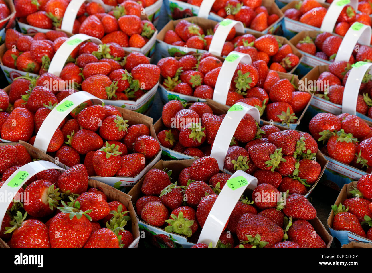 Baskets of fresh strawberries for sale at the Jean Talon public market or Marche Jean Talon, Montreal, Quebec, Canada Stock Photo