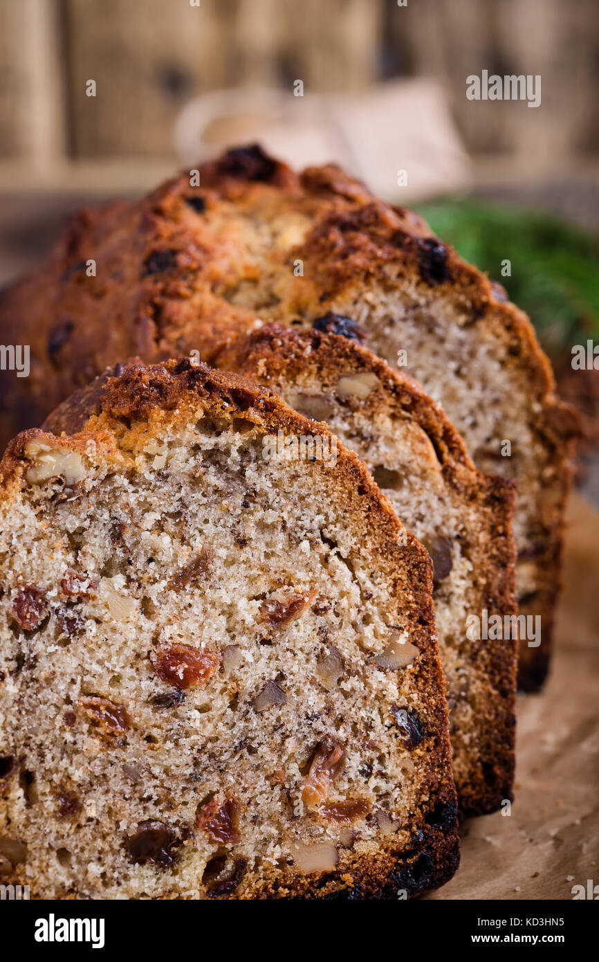 Homemade christmas cake with dried fruits and nuts on rustic wooden