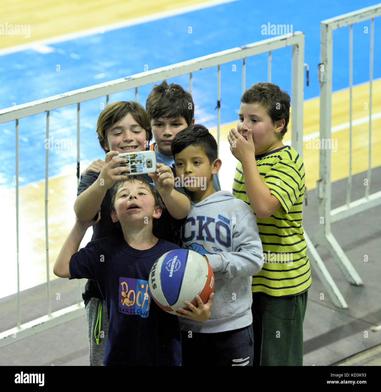 Five kids take a selfie while Peñarol de Mar del Plata plays against Gimnasia de Comodoro (PH: Demián Schleider) Stock Photo