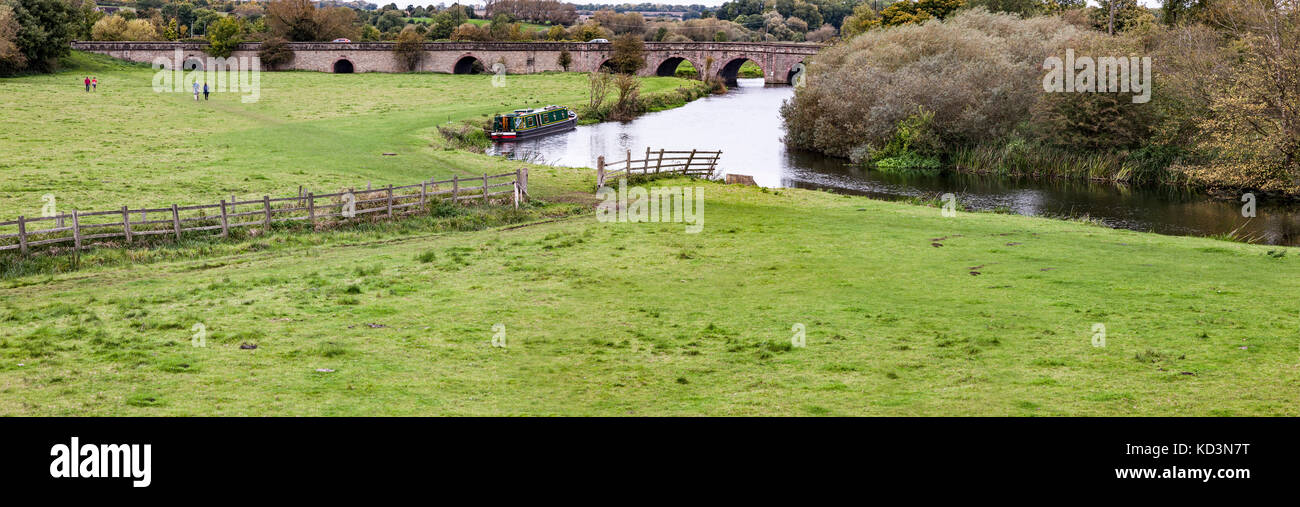 The river Nene going under a stone ached bridge near Oundle, Northamptonshire, U.K. Stock Photo