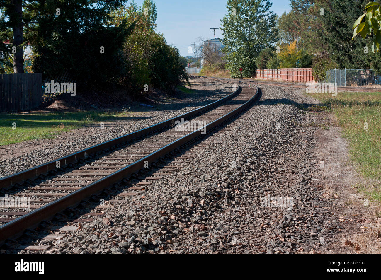 Train tracks through a rural neighborhood Stock Photo Alamy