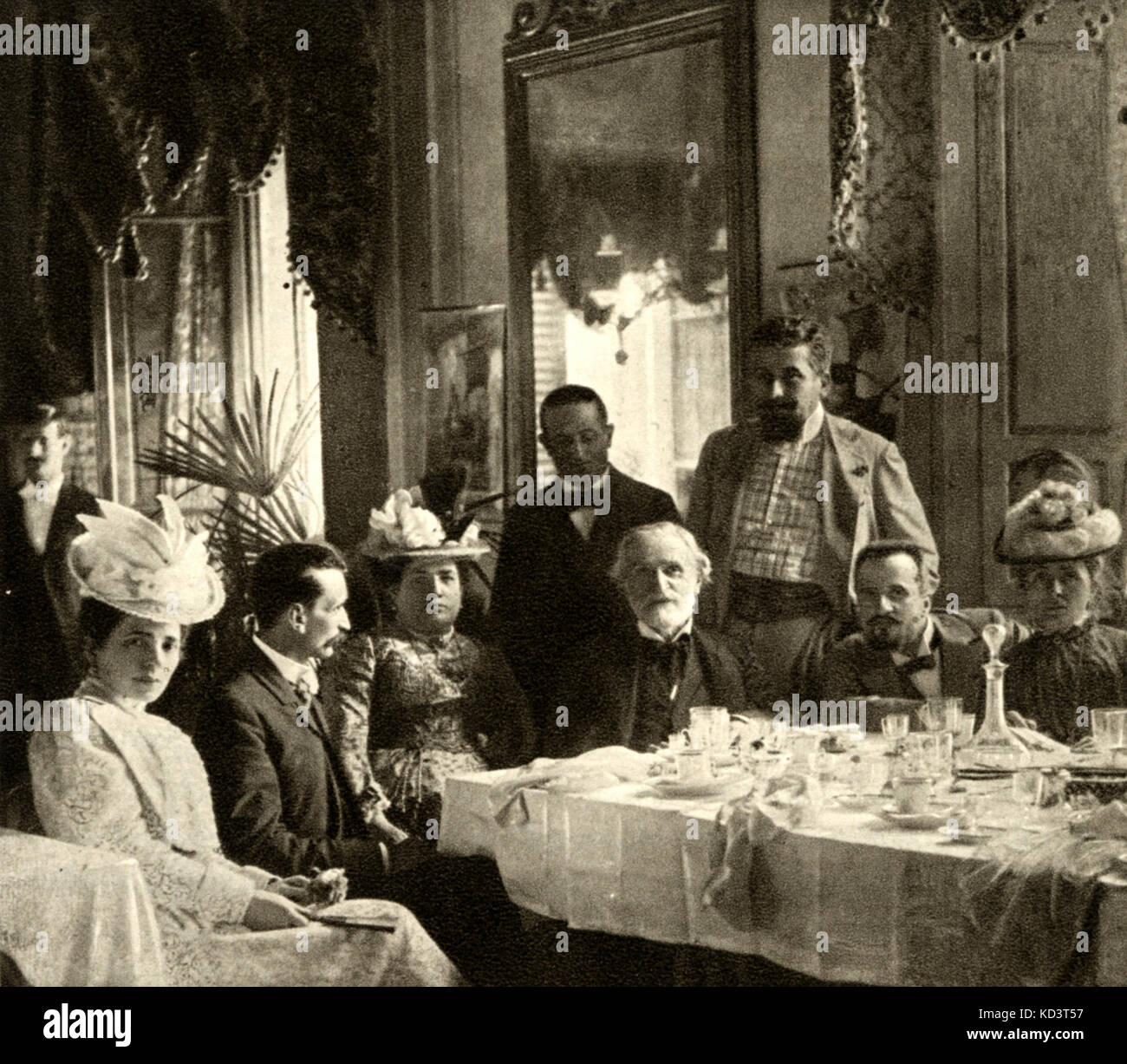 VERDI, seated at the table,  from left to right are Teresa Stolz, Prof. Grocco, Giuseppina Pasqua, Leopoldo Mugnone and his wife.  Italian composer (1813-1901). Stock Photo