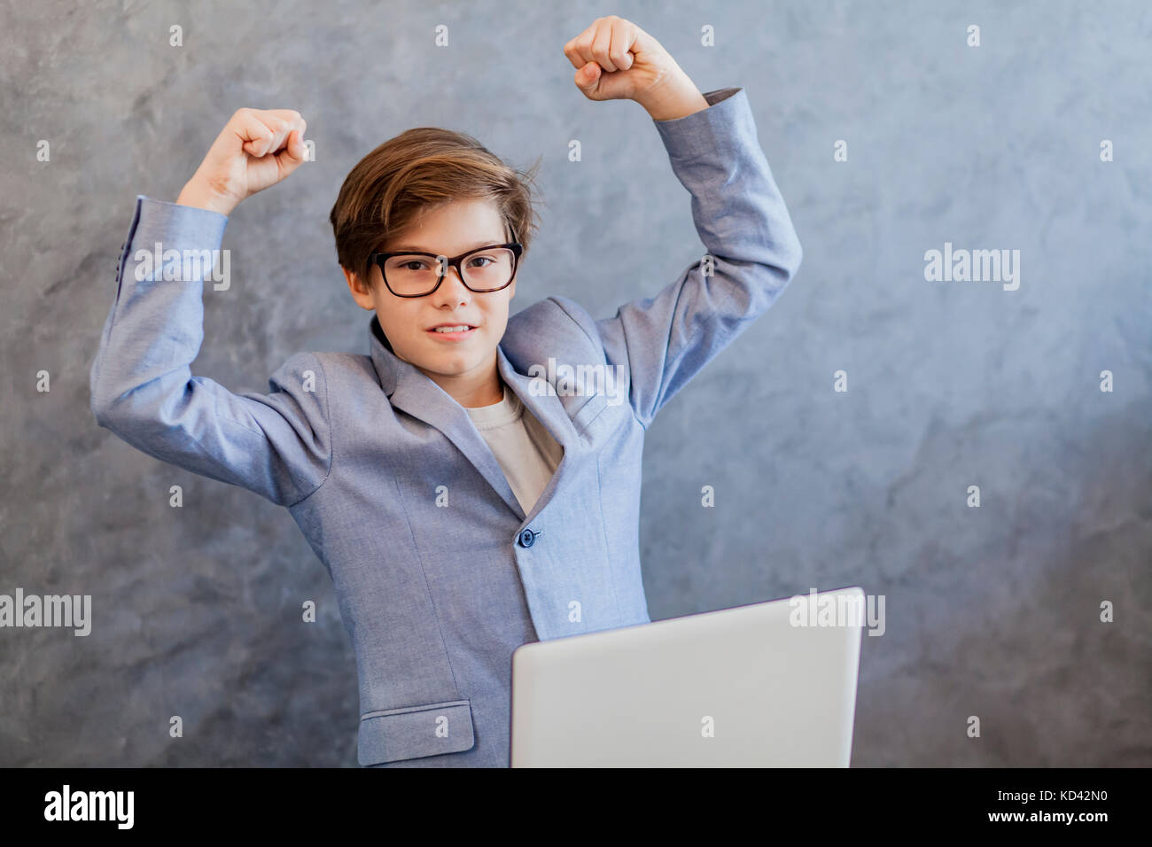 Portrait of happy teen boy with laptop Stock Photo - Alamy