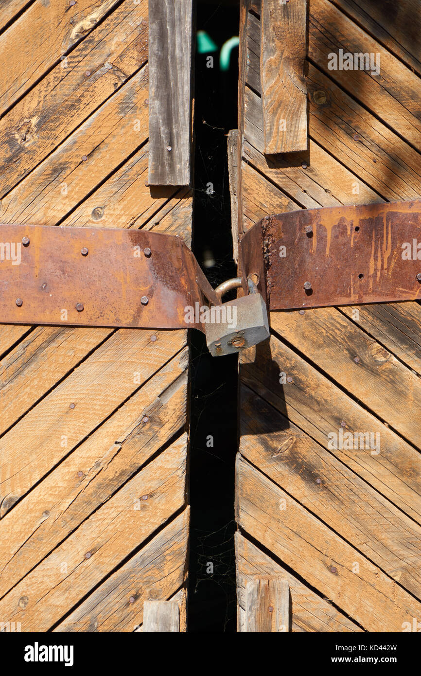 old wooden door closed with rusty padlock Stock Photo - Alamy