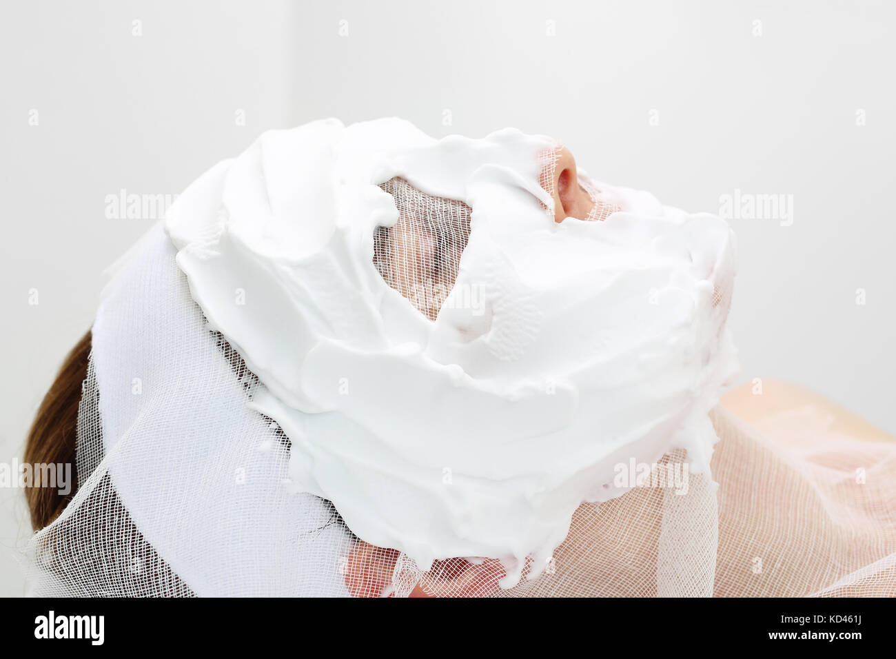 Mask applied to gauze. The woman in the beauty salon is relaxing during the skin care treatment. Stock Photo