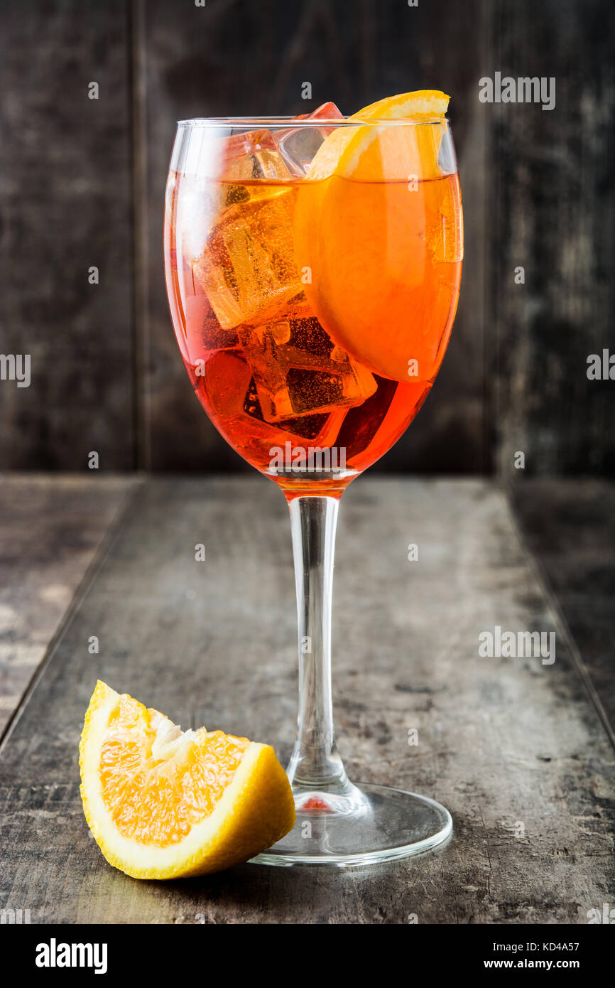 Aperol spritz cocktail in glass on wooden table Stock Photo