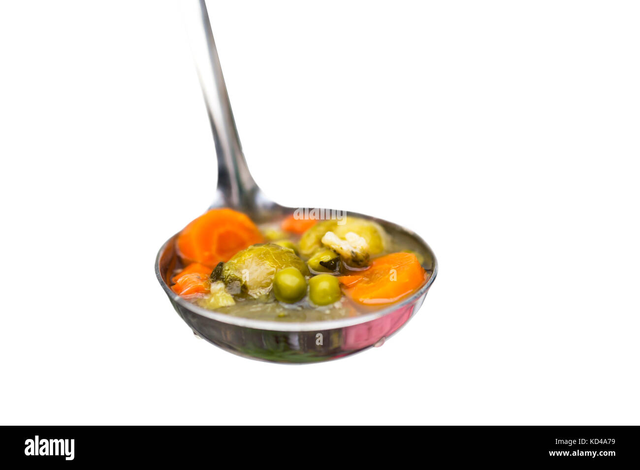 Vegetable soup on ladle isolated Stock Photo Alamy