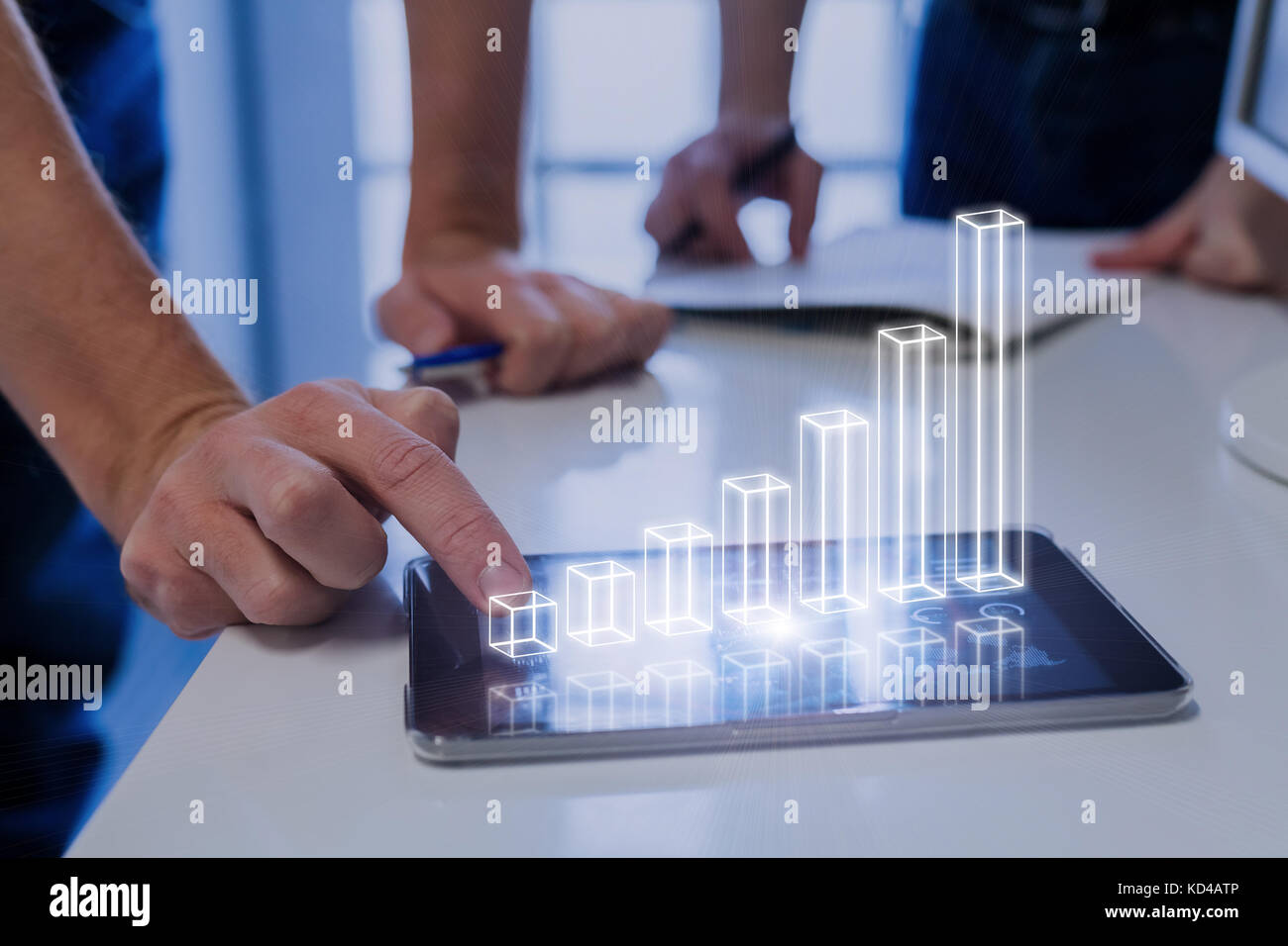Team of business people analyzing 3D augmented reality chart above digital tablet computer screen showing growing results and investment success, tech Stock Photo