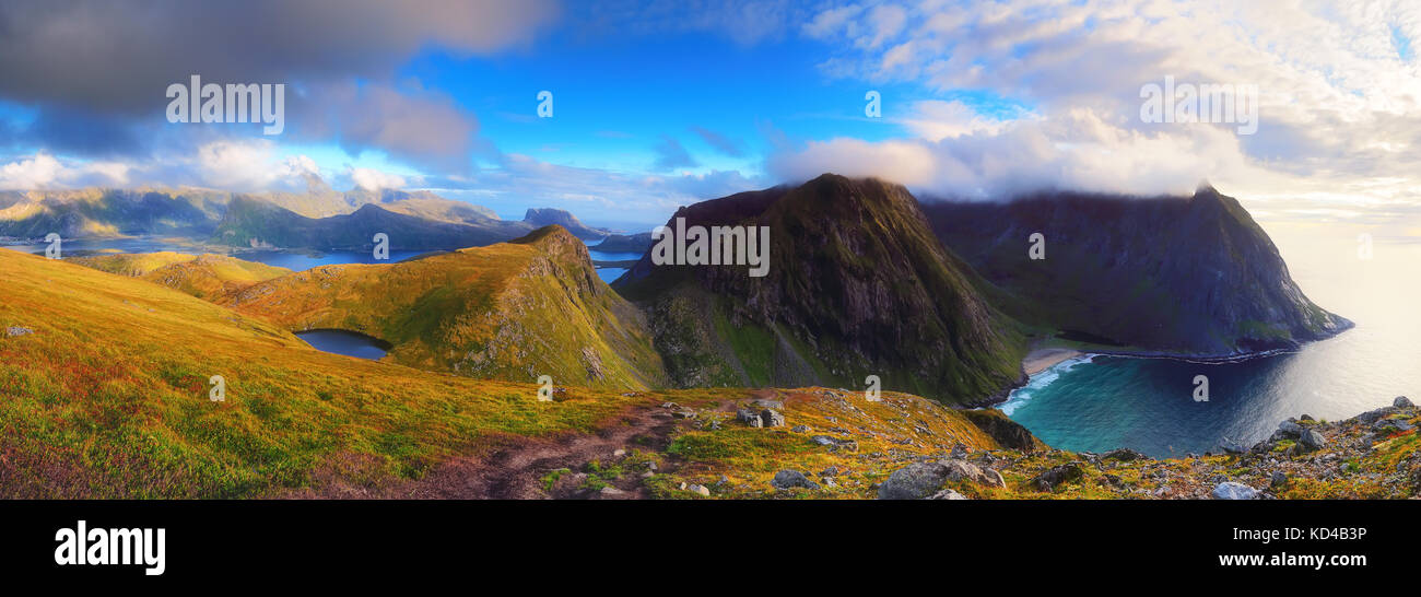 Panoramic norwegian landscape of rocks and fjords. Sunny day in norway mountains. Stock Photo