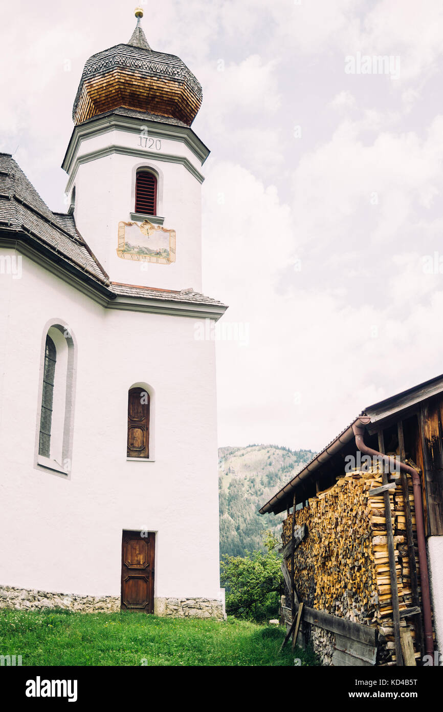 Church chapel in the mountain village Wamberg in the German Alps. Stock Photo
