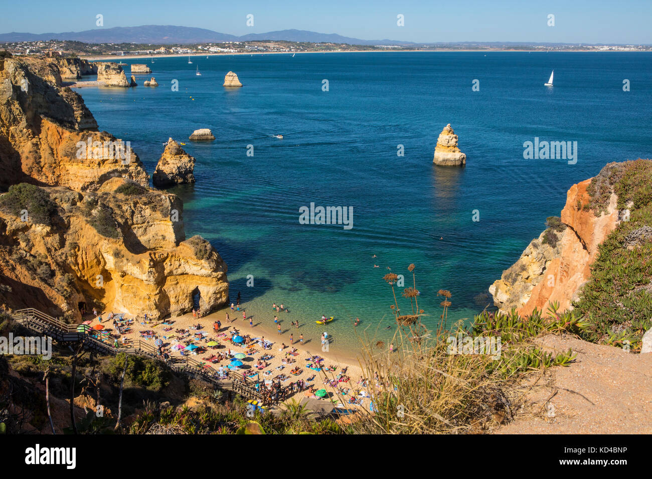 A view of the beautiful Praia do Camilo in Lagos, Portugal. Meia Praia can  been seen in the distance Stock Photo - Alamy