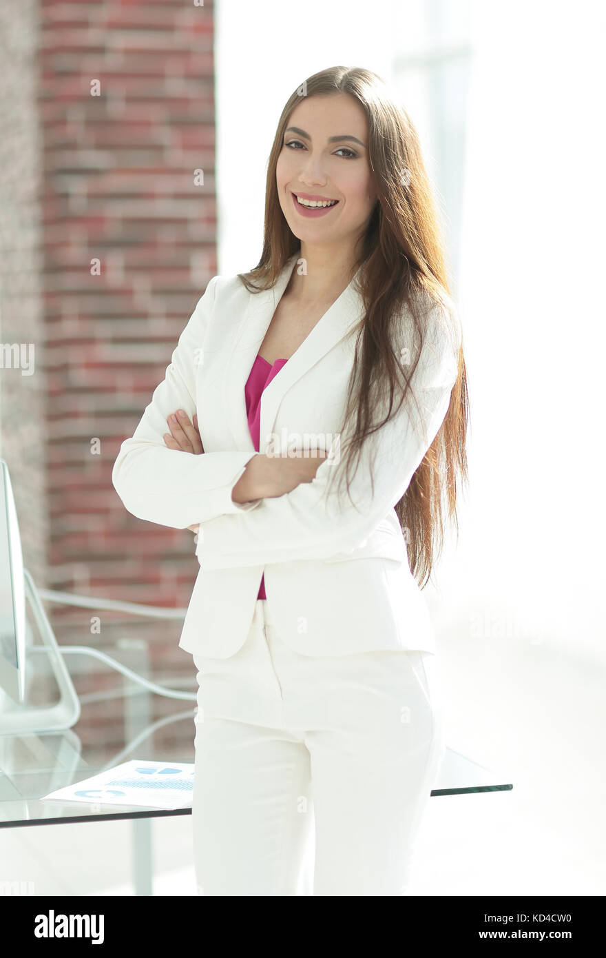 elegant business woman in a white business suit Stock Photo - Alamy