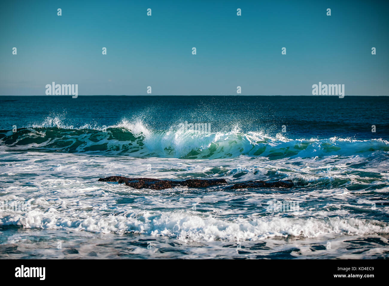 Blue sea with waves and clear blue sky, vintage color Stock Photo - Alamy