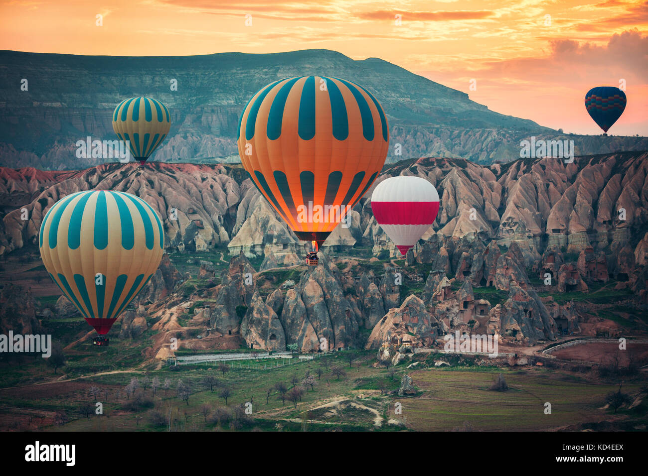 Hot air balloons flying over the valley at Cappadocia, Turkey Stock ...