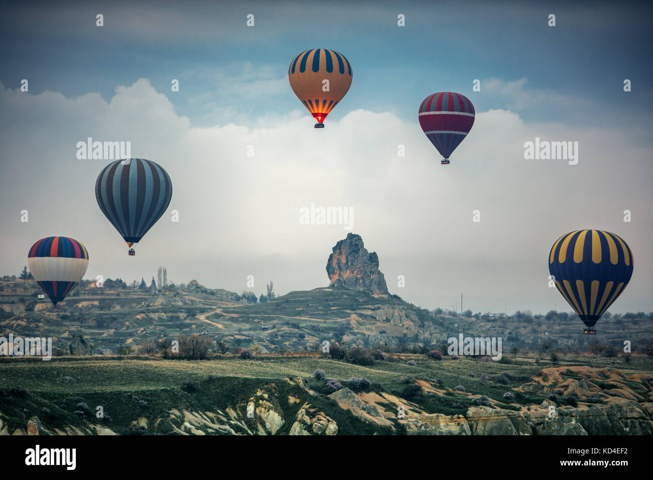 Hot air balloons flying over the valley at Cappadocia, Turkey Stock ...