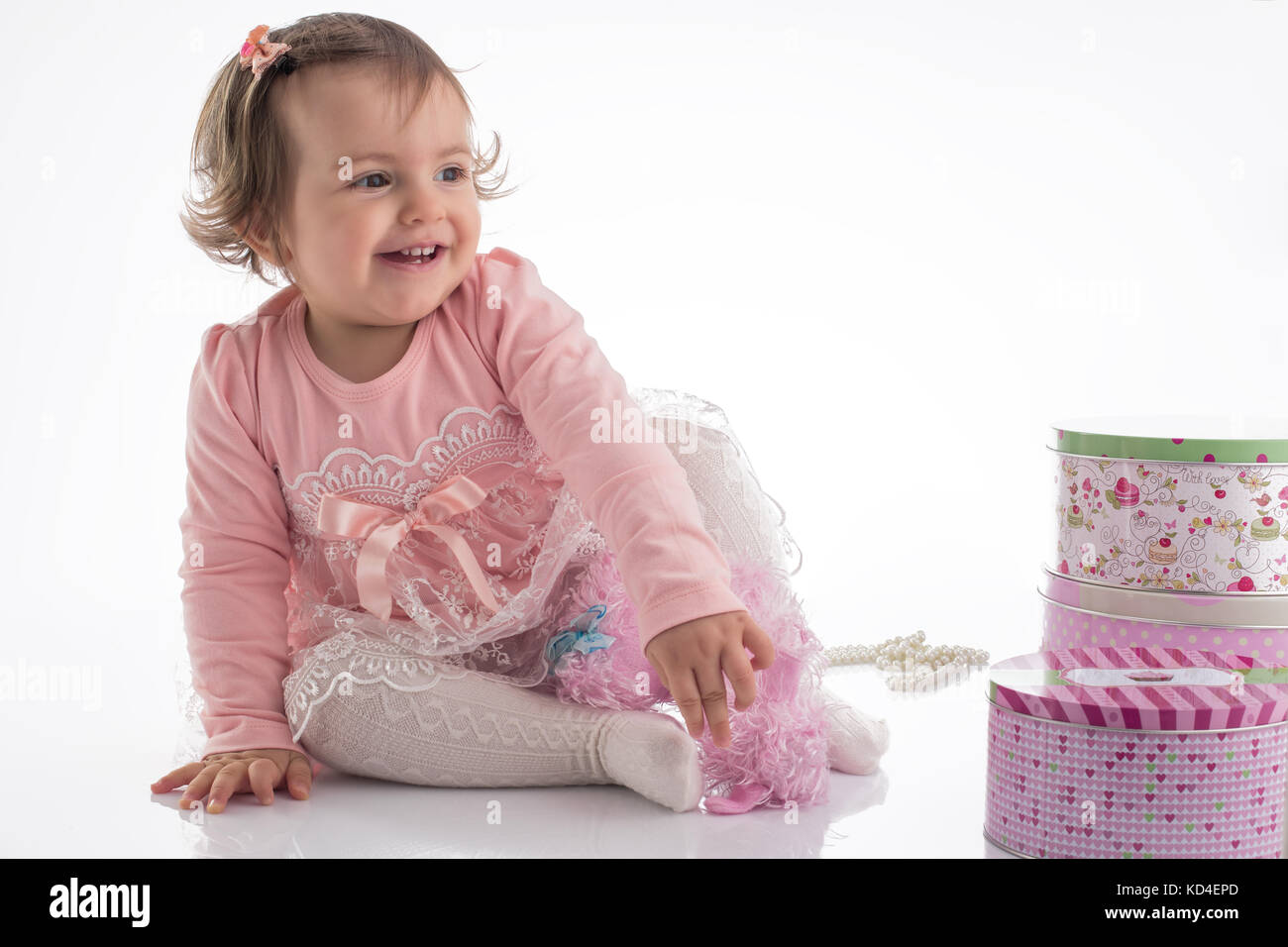 Happy little baby girl with pink birtdhay dress, isolated on white ...