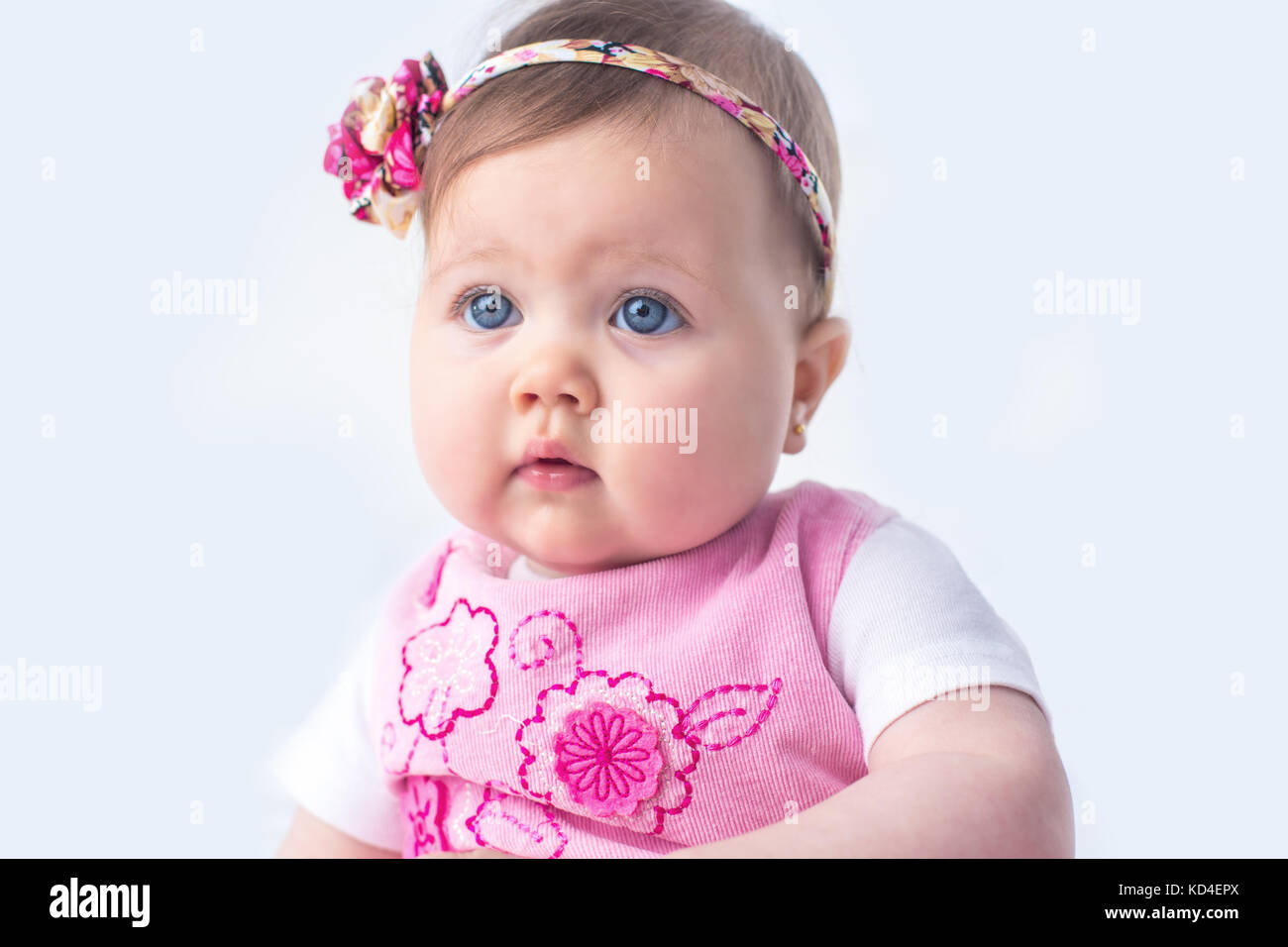 Portrait of a smilling baby girl on a white background Stock Photo