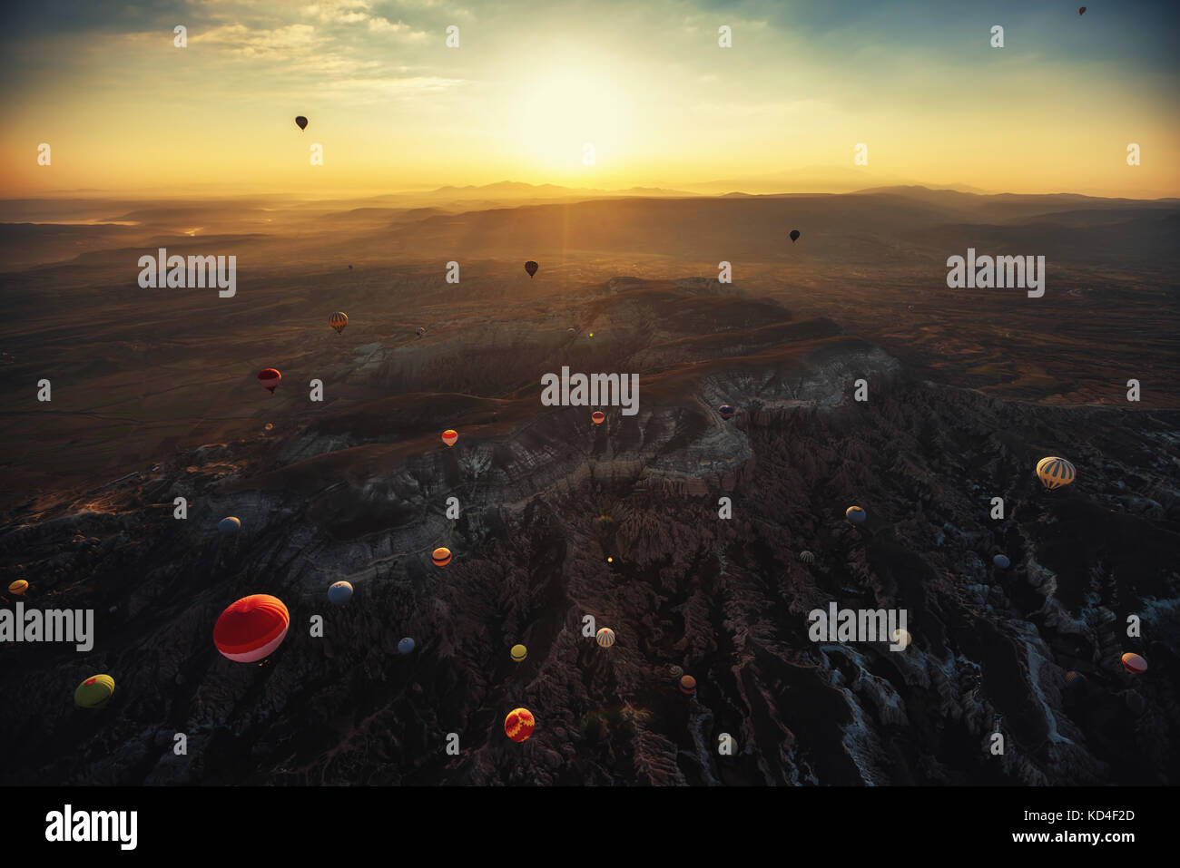 Hot air balloons flying over the valley at Cappadocia, Turkey Stock ...