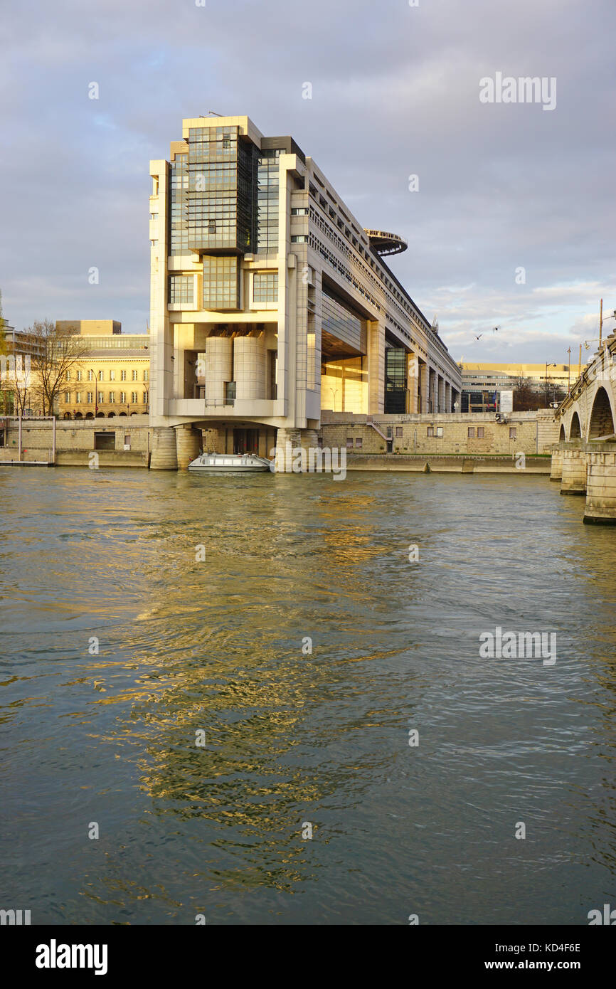 The headquarters of the French Ministry of Finance and Economy in the Bercy neighborhood in the 12th arrondissement of Paris, extending over the Seine Stock Photo