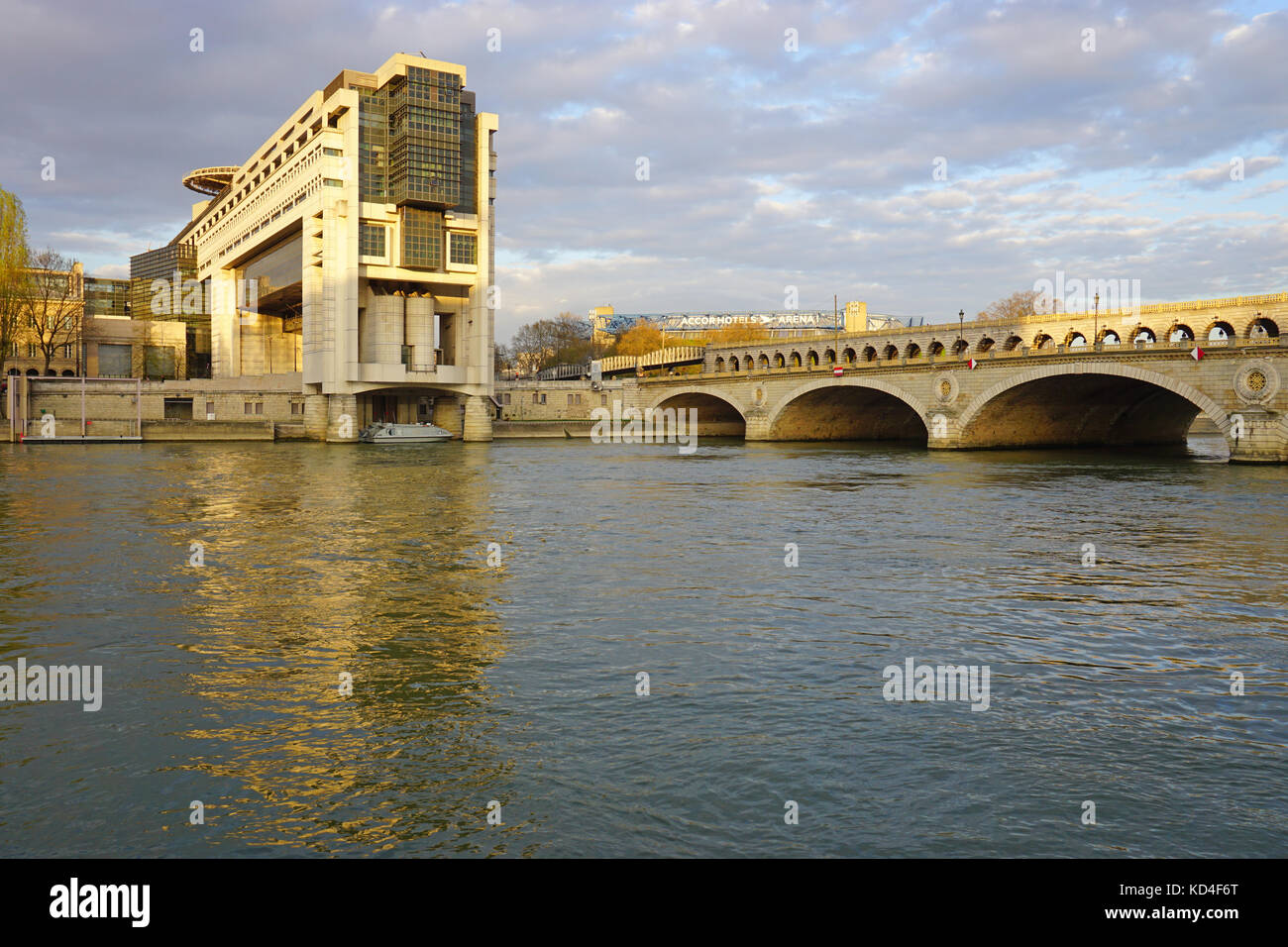 The headquarters of the French Ministry of Finance and Economy in the Bercy neighborhood in the 12th arrondissement of Paris, extending over the Seine Stock Photo